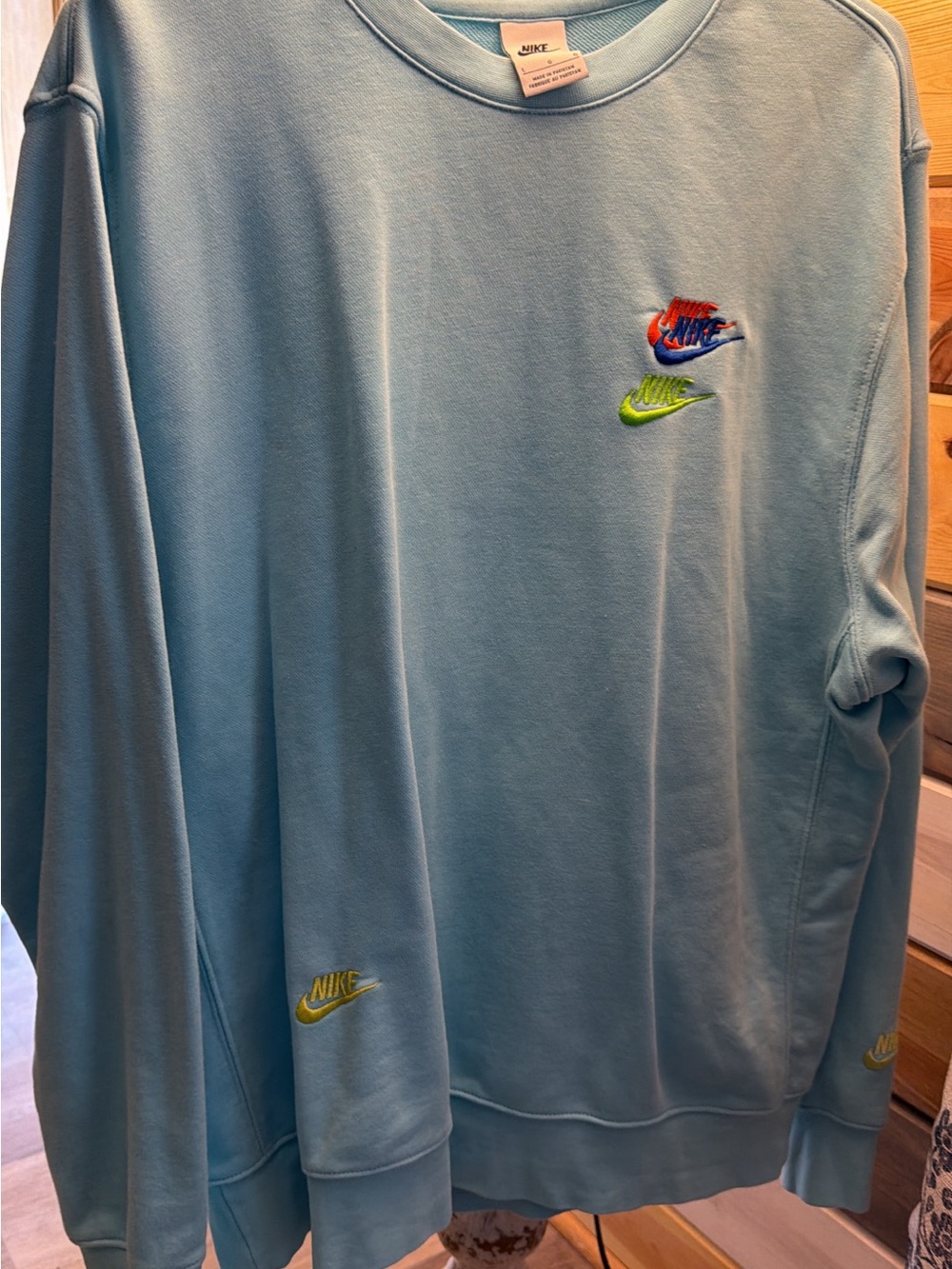 Nike Light Blue Crewneck Sweatshirt with Multicolor Embroidered Swooshes